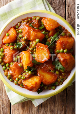 Spicy Aloo Matar potatoes, green peas and spices 38924403