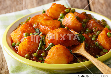 Indian hot Aloo Matar - potatoes, green peas 38924409