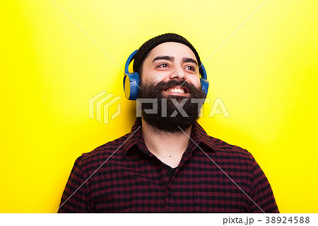 Portrait of a happy smiling hipster with a long 38924588