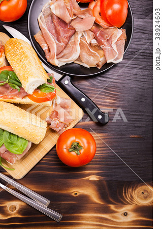Homemade sandwiches on a wooden board Homemade sandwiches on a wooden board 38924603