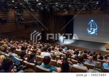 Business speaker giving a talk in conference hall. 38925884