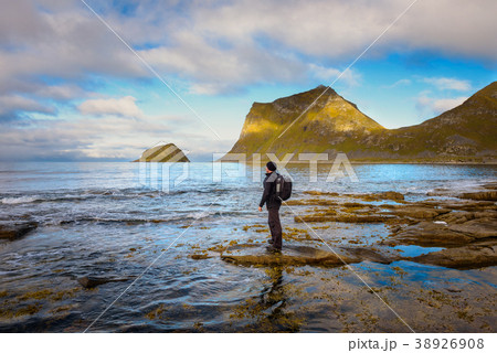 Hiker at Haukland beach on Lofoten islands, Norway 38926908