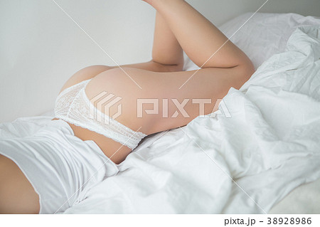 attractive girl with cute ass in bed - Stock Photo 38928986 pic