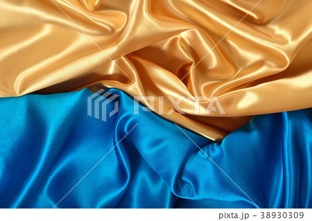 Natural golden and blue satin fabric texture 38930309