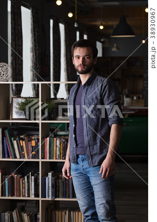 guy near a bookcase 38930967