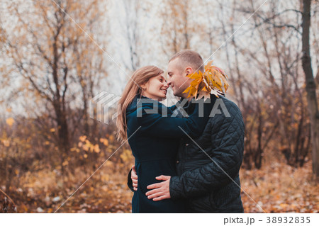 Happy couple in the autumn park 38932835