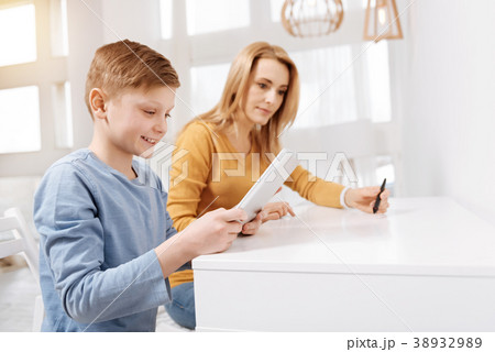 Joyful happy boy using a tablet 38932989