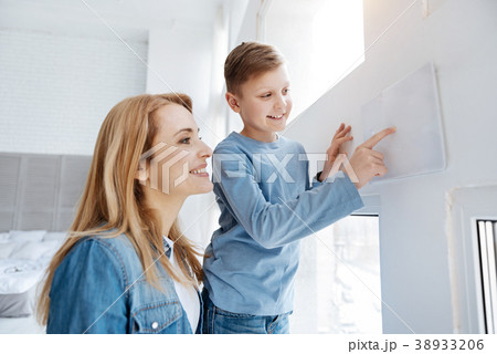 Joyful happy boy living in the smart house Joyful happy boy living in the smart house 38933206