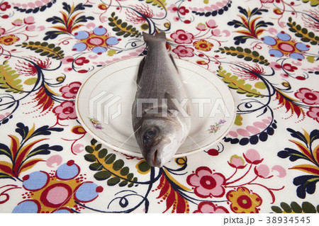 bass fish inside a flower plate bass fish inside a flower plate 38934545