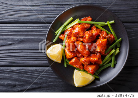 Indian chicken 65 with sauce and green onions Indian chicken 65 with sauce and green onions 38934778