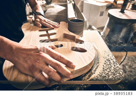 Manufacture of guitars. 38935183
