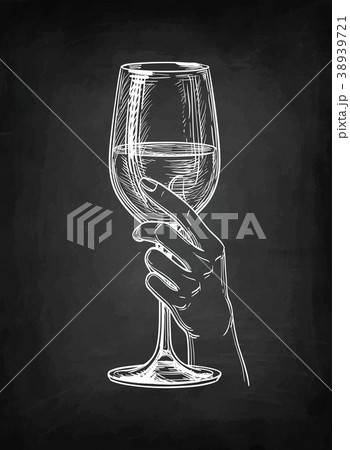 Hand holding a glass of wine. 38939721
