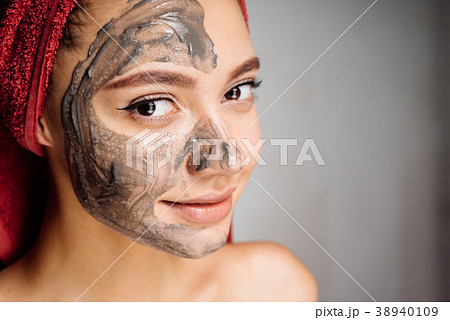 girl applied a useful clay mask on her face,spa girl applied a useful clay mask on her face,spa 38940109