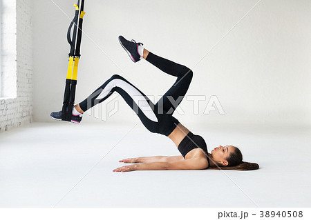 Fit pretty young woman doing stretching. 38940508