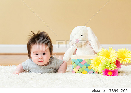 Baby boy with a rabbit celebrating Easter 38944265
