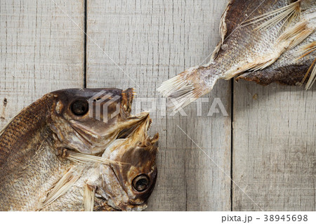 Dried fish on wooden. Dried fish on wooden. 38945698