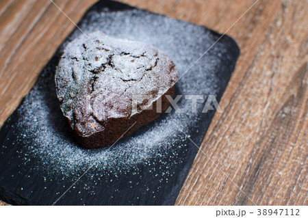 cupcake in the form of a heart with powdered sugar cupcake in the form of a heart with powdered sugar 38947112