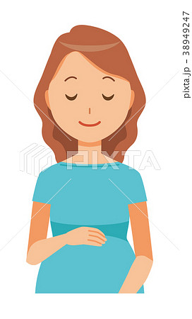 グリーンの服を着た妊婦が笑顔でお腹を見ている 38949247