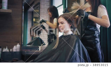 Young blonde woman is sitting in chair in beauty Young blonde woman is sitting in chair in beauty 38953015