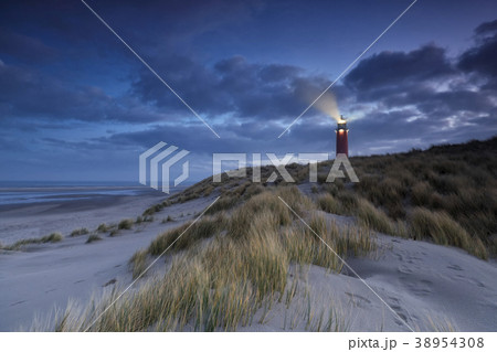 lighthouse on dune in dusk 38954308