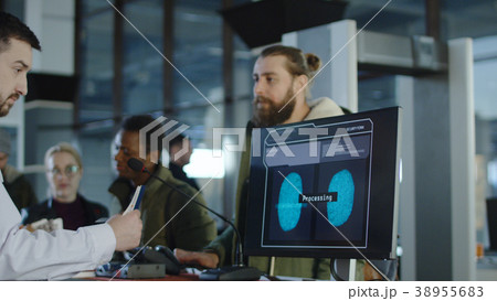 Man passing biometric control at counter 38955683