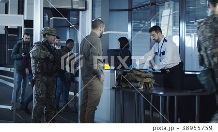 Airport security apprehending a suspect 38955759