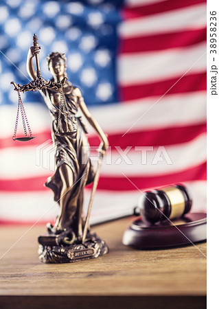 Lady Justice and American flag. Symbol of law. 38958236