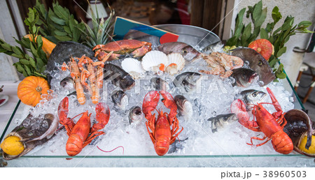 Seafood on ice at the fish market. 38960503