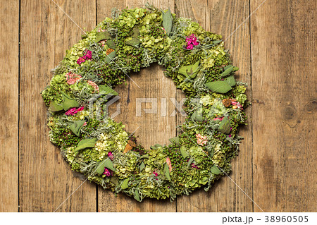 beautiful flower wreath isolated on awooden 38960505