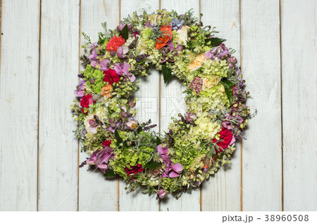 beautiful flower wreath isolated on awooden 38960508