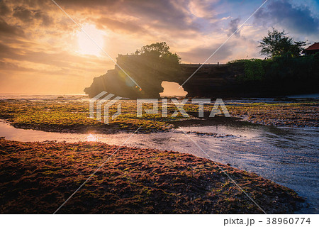 Tanah Lot Temple on sea at sunset in Bali Island 38960774
