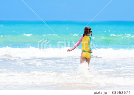Kids play on tropical beach. Sand and water toy. 38962674