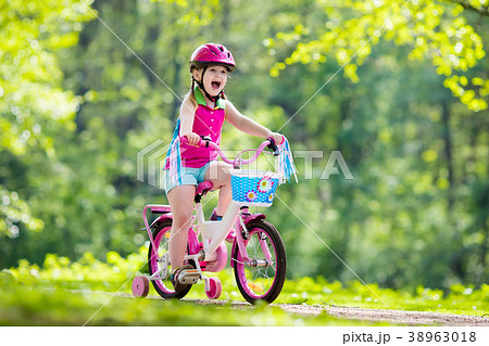 Child riding bike. Kid on bicycle. 38963018