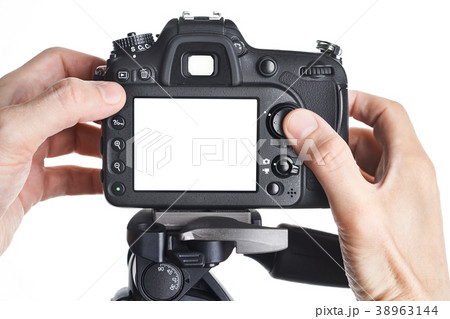 Hands photographer adjust SLR camera isolated 38963144