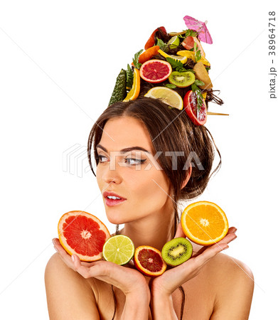 Hair mask from fresh fruits on woman head. Bare 38964718