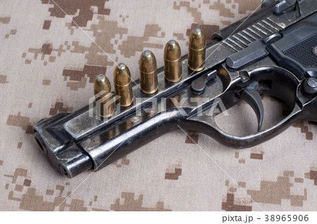 Beretta hand gun on desert marines uniform Beretta hand gun on desert marines uniform 38965906