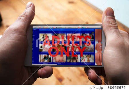 Internet porn addiction. A mobile phone with a war 38966672