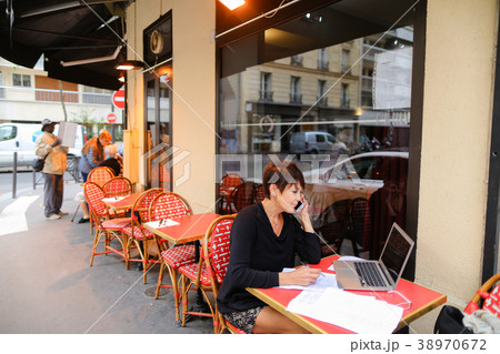 middle-aged female tourist listen music by 38970672