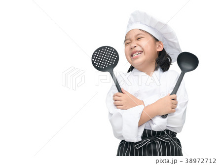 Happy asian girl chef holding cooking utensils 38972712