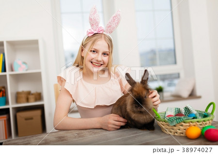 Teenage girl holding Easter eggs 38974027