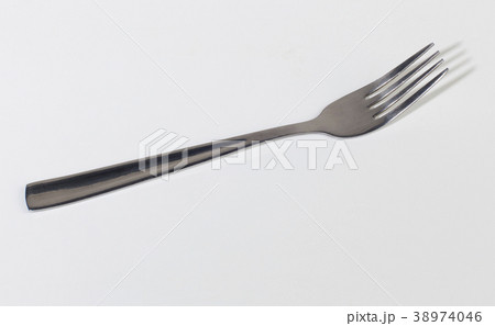 dining fork over white background dining fork over white background 38974046