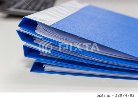 file folder and Stack of business report  38974792