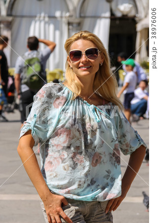 Pretty woman with long blond hair in Venice, Italy 38976006