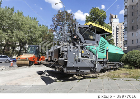 heavy asphalt paver and road vibrating roller heavy asphalt paver and road vibrating roller 38977016