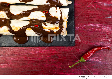 Mexican chicken enchiladas with chili chocolate 38977357