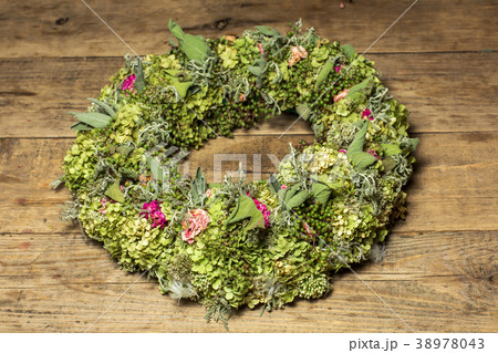 a beautiful flower wreath isolated on awooden 38978043