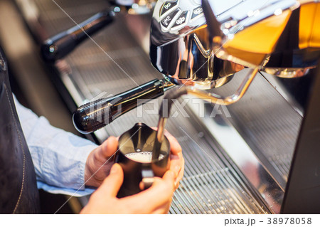 coffee machine makes two coffee with coffee beans. coffee machine makes two coffee with coffee beans. 38978058