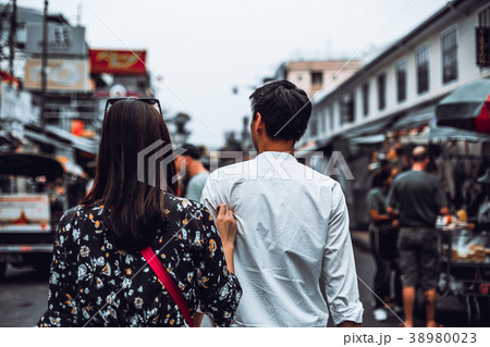 Back view of young couple enjoy walking at Khaosan Back view of young couple enjoy walking at Khaosan 38980023