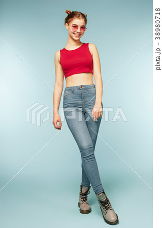 Woman smiling with perfect smile on the blue 38980718