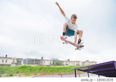 Young skateboarder in a jump 38981839